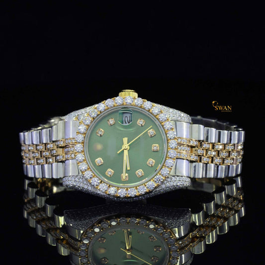 Silver-toned and gold iced-out watch with a green dial, a diamond-encrusted bezel, and a link band by swandiamond